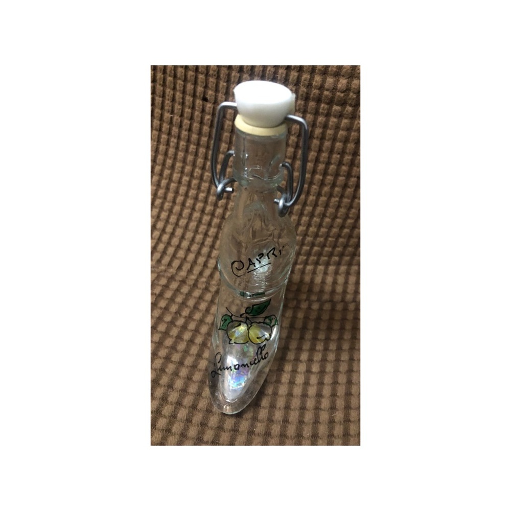 Empty small bottle of capri lemoncillo